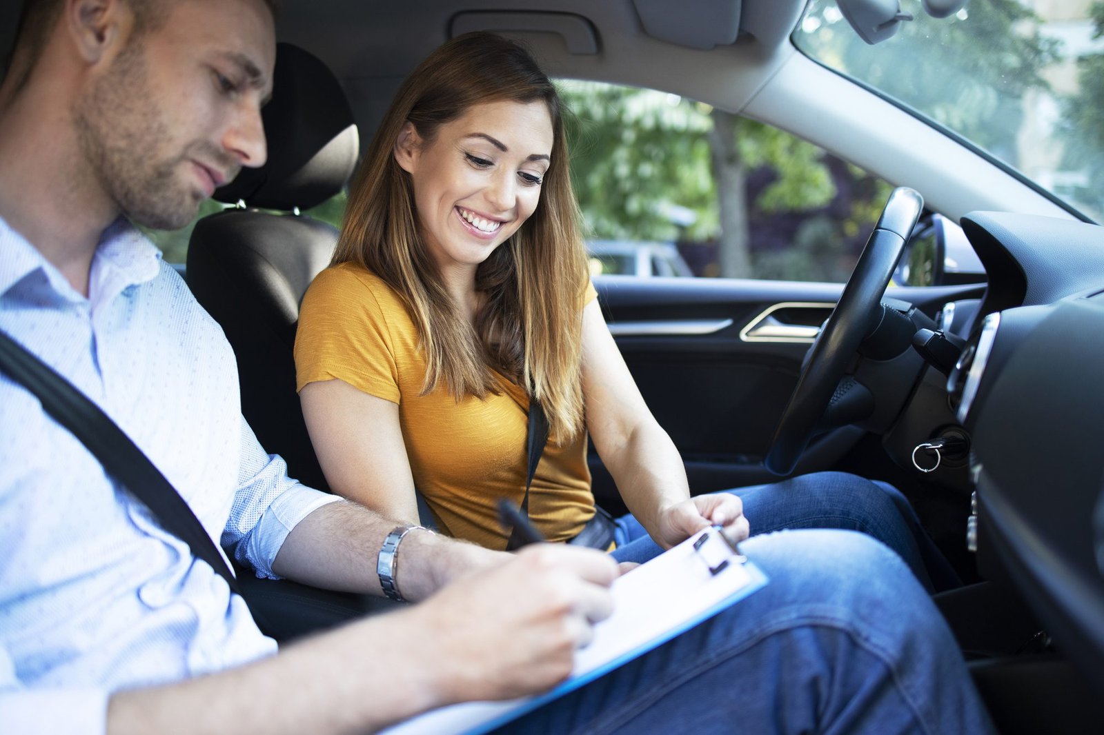 Driving instructor explaining Montreal traffic rules to new student driver