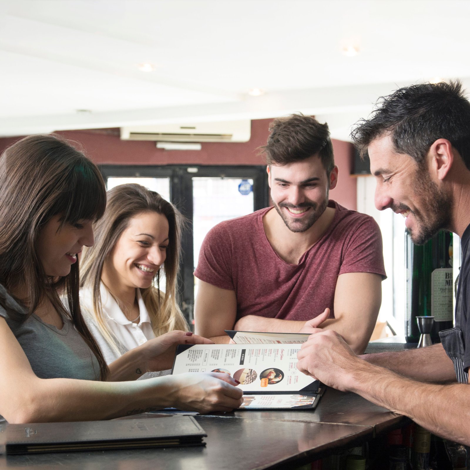 Satisfied driving school customers reviewing course options and pricing