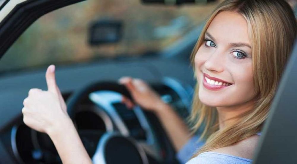 Female student driver passing SAAQ road test after Montreal driving lessons.